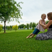 Woman and young girl sitting on RTF tall fescue turf