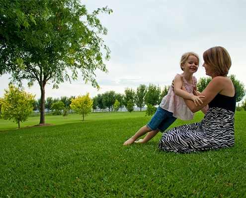 Woman and young girl sitting on RTF tall fescue turf