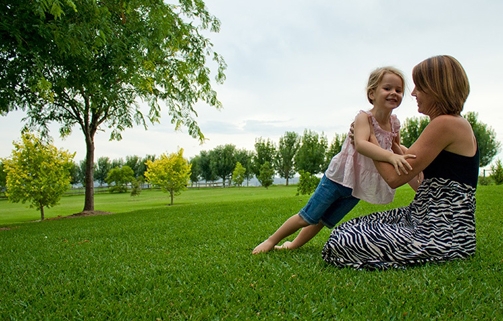 Woman and young girl sitting on RTF tall fescue turf